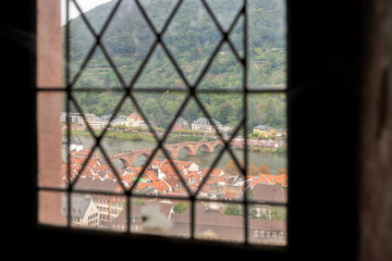 Castle Window View Old Town and Neckar River.A high angle, view of Heidelberg&rsquo;s old bridge over the Neckar River from Heidelberg Castle.

