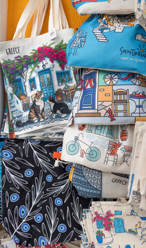 Stack of Greece and Santorini souvenir tote bags and pouches for sale at street vendor, Greece, 4 October 2025