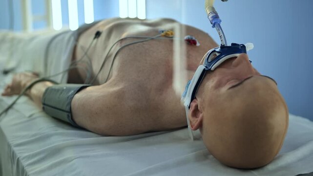 Medical training mannequin featuring intubation tube and vital sign monitors