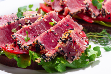 Breakfast, sandwiches, fried tuna fillet, in sesame seeds, no people, top view, homemade, © DideBashvili