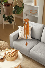 Golden wind chime hanging in living room
