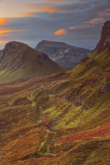 Trotternish ridge, land-slipped mass of Cleat at the foot of Bioda Buidhe summit seen from Quiraing at a colorful, beautiful dawn. Skye-Scotland-162
