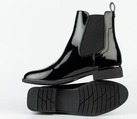 Black leather boots on white background for online retail display