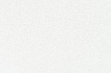 White surface with texture and subtle details in bright light