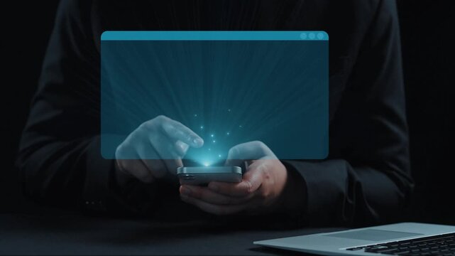 This image depicts hands holding a smartphone illuminated by colorful coding languages, demonstrating the intersection of technology and programming education in a modern environment. Qubit