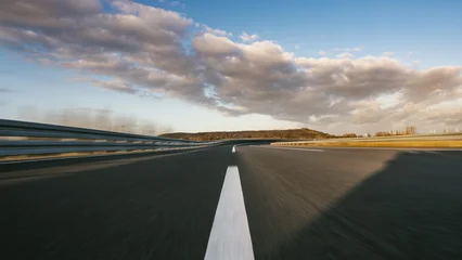 Race Car / motorcycle racetrack on a sunny day. © AA+W