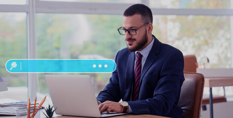 Young businessman using laptop in office. Concept of search