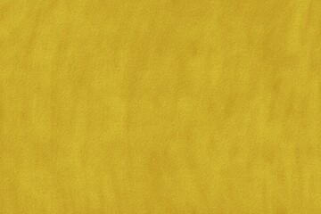 Yellow surface with a soft texture and subtle variations visible in lighting and pattern created by shadows