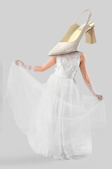Naklejka premium Beautiful bride in white wedding dress on light background