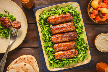 Tarb is a middle Eastern dish that combines minced meat, onions and various spices. It wrapped in a layer of lamb fat and grilled to a golden brown color. It's one of the most popular dishes in Egypt.