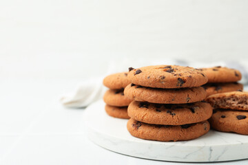 Delicious chocolate chip cookies on light table, closeup. Space for text