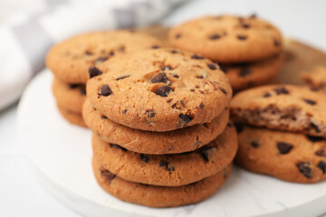 Delicious chocolate chip cookies on table, closeup