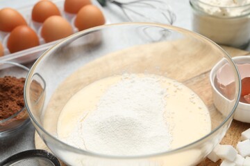 Different ingredients for dough on grey table, closeup