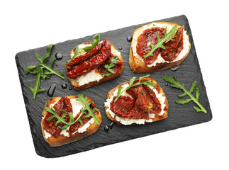 Delicious bruschettas with cream cheese, sun-dried tomatoes and arugula isolated on white, top view