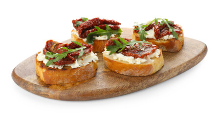 Delicious bruschettas with cream cheese, sun-dried tomatoes and arugula isolated on white