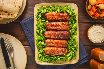 Tarb is a middle Eastern dish that combines minced meat, onions and various spices. It wrapped in a layer of lamb fat and grilled to a golden brown color. It's one of the most popular dishes in Egypt.