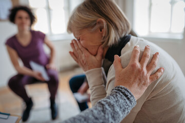 Woman finding support during group therapy.