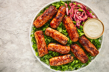 Tarb is a middle Eastern dish that combines minced meat, onions and various spices. It wrapped in a layer of lamb fat and grilled to a golden brown color. It's one of the most popular dishes in Egypt.