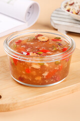 Red Lentil Soup with Nuts and Vegetables in Glass Container