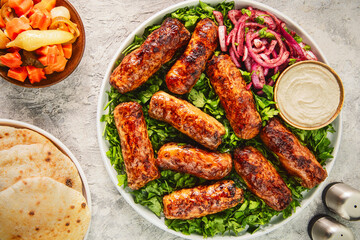 Tarb is a middle Eastern dish that combines minced meat, onions and various spices. It wrapped in a layer of lamb fat and grilled to a golden brown color. It's one of the most popular dishes in Egypt.