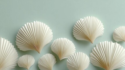 A series of white paper flowers, each with a unique design