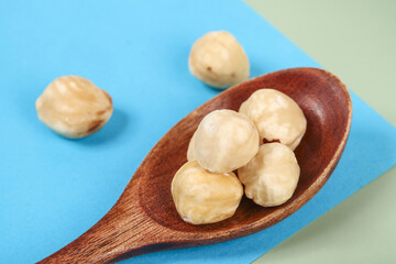 Roasted Macadamia Nuts in Wooden Spoon Health Food Snack