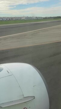 Vertical video. The moment a plane lands on the airfield runway. Mallorca, Spain.