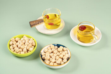 Roasted Chickpeas and Oil on Mint Background