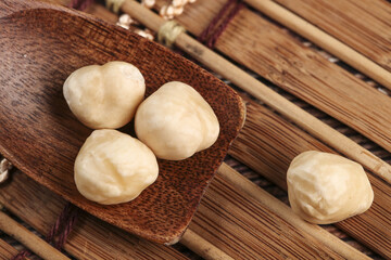 Roasted Macadamia Nuts on Wooden Surface - Healthy Snack