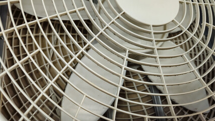 well used portable fan cover or grill close-up background. Heat wave or weather abstract design element.