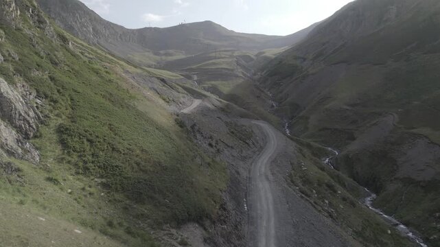 Aerial view of a winding mountain road leading to Abano Pass in the Tusheti region of Georgia