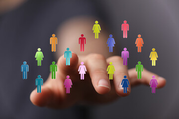 Abstract image of hand touching vibrant people icons. Concepts of diversity, teamwork, and digital connectivity. Ideal for business, social, or