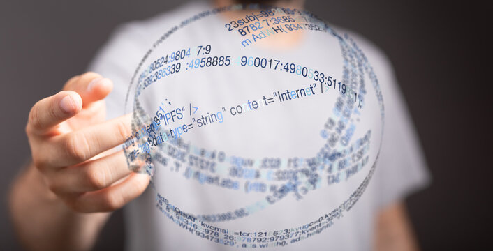 A person holds a digital globe with data and code floating on the surface, representing internet and technological advancement. - Powered by Adobe