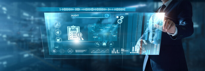 Businessman analyzing Audit data on virtual interface financial compliance, error detection, report validation, transparency review, risk assessment, regulatory accuracy.