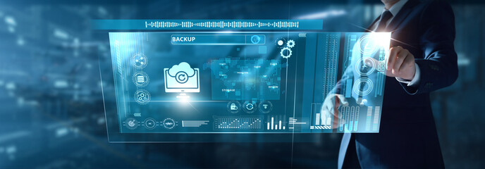 Businessman analyzing Backup data on virtual interface data recovery, storage integrity, cloud protection, system continuity, security layers, digital resilience.