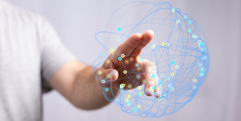 Hand reaching out to interact with a digital sphere representing global connectivity, technology, and innovation. Suitable for business, finance