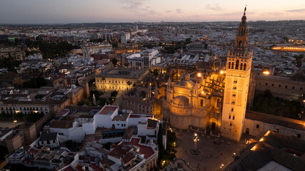 Obraz premium Night time aerial view of the historic old town city center of Seville, Andalusia, Spain.