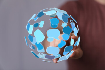 Concept of global communication network represented with speech bubbles in digital space for connection and social media.