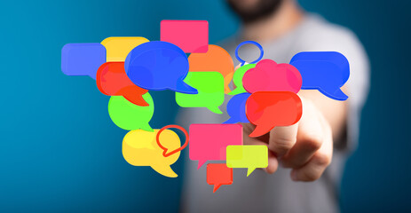 Image of person pointing at many floating colorful speech bubbles, representing online communication, ideas, an