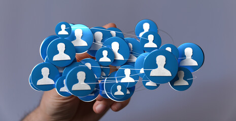 Hand presenting a digitally rendered network of connected user icons. Concept for social media, connections, and community.