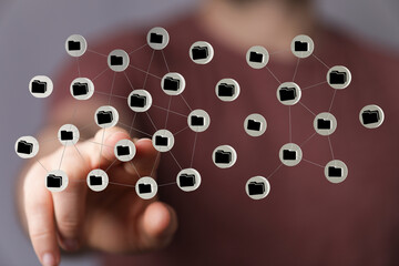 Abstract concept of data connection and cloud computing. Hand pointing to digital network of folders.