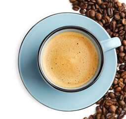 Aromatic coffee in cup and beans on white background, top view