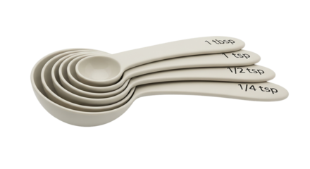 Essential kitchen measuring spoon set for precise baking and cooking Accurate beige plastic culinary utensils for modern