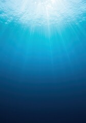 A beautiful abstract background texture showcasing the immense depth of the sea, illuminated by bright sunlight beams piercing the pure blue water column, light, depth, aquatic