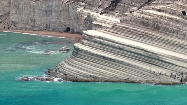Scala dei Turchi, or the Turkish stairs in Sicily, Italy. Aerial Drone Shot. Unique White Rocks and Turquoise water.