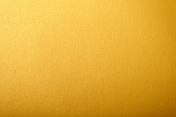 Golden background texture with glitter and shine. A perfect abstract background for luxury and elegance, ideal
