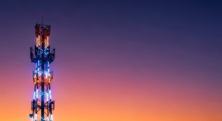 Telecommunication tower with cellular antennas against a vibrant sunset sky at dusk. Concept of global network, internet and 5g technology for communication industry banner.