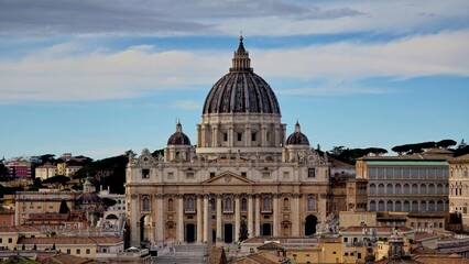 Vatican City - 12 January 2025. The facade and dome of St. Peter&rsquo;s Basilica dominate the skyline in this view from Castel Sant&rsquo;Angelo under a partly cloudy sky.
