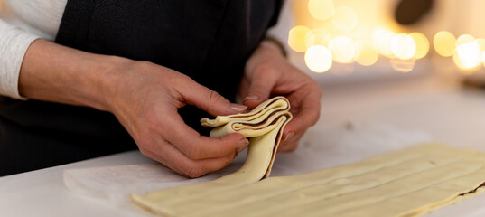 Obraz premium Cookie Dough For Raw Christmas Tree Sticking To Hands During Cooking Process