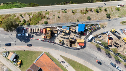 Aerial View of Construction Site with Machinery and Vehicles